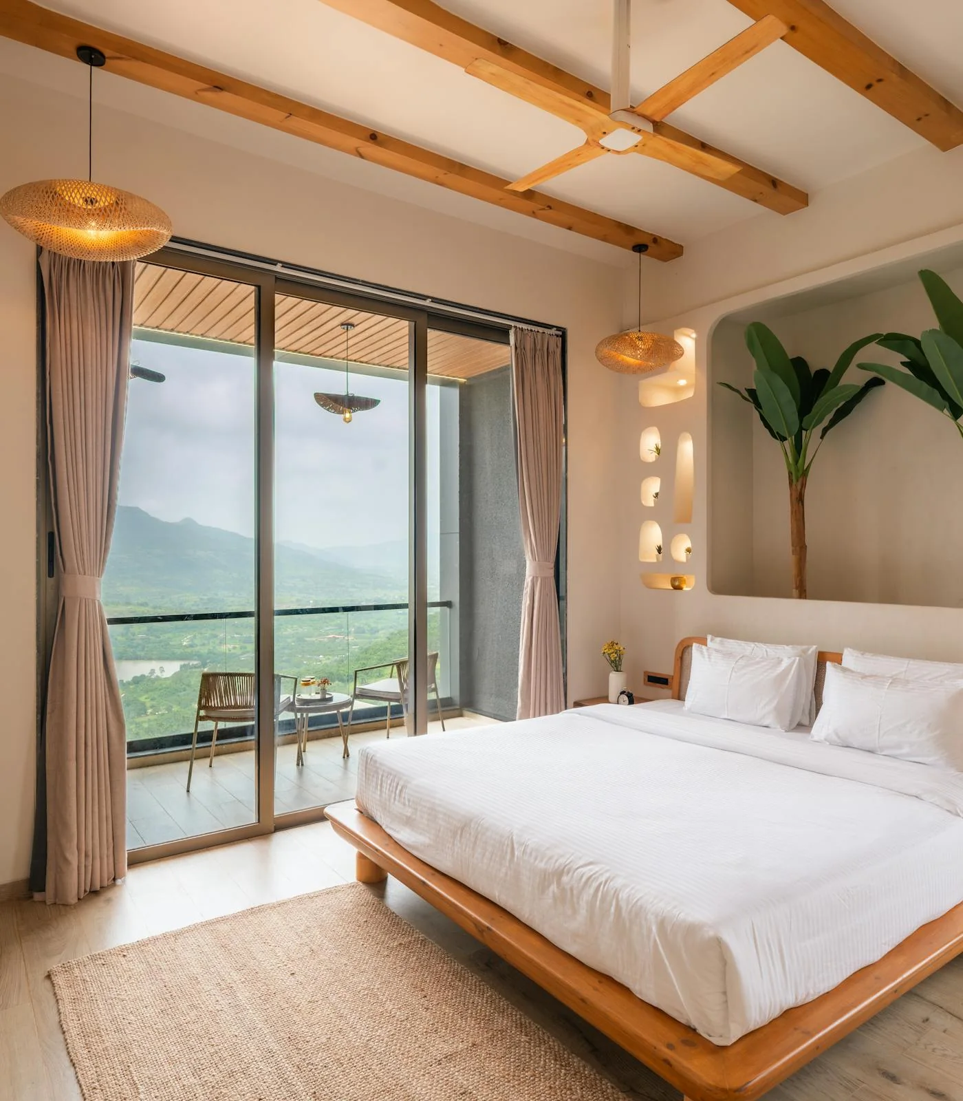 Calm bedroom with balcony and mountain outlook