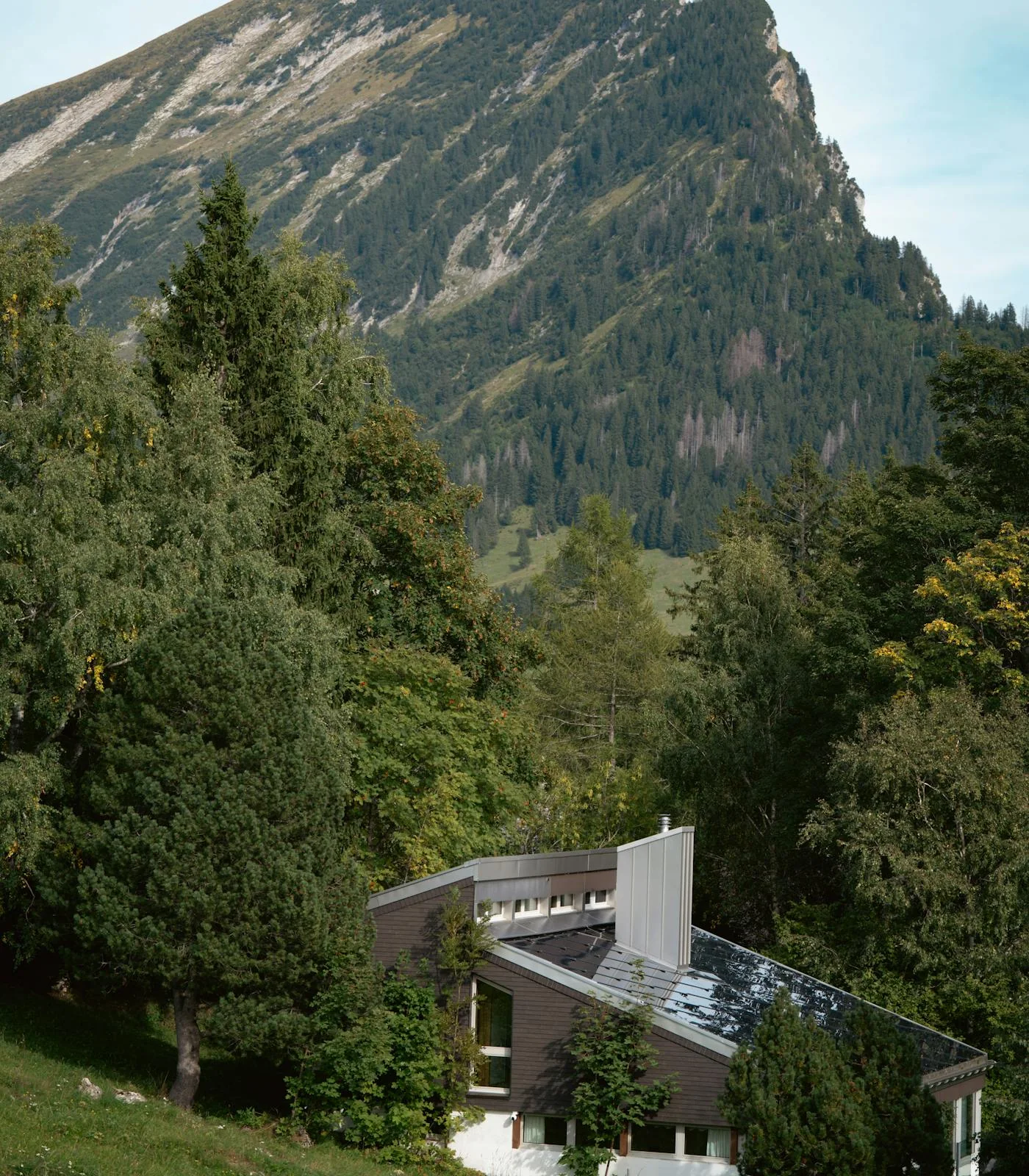 Private alpine residence set below forested mountains