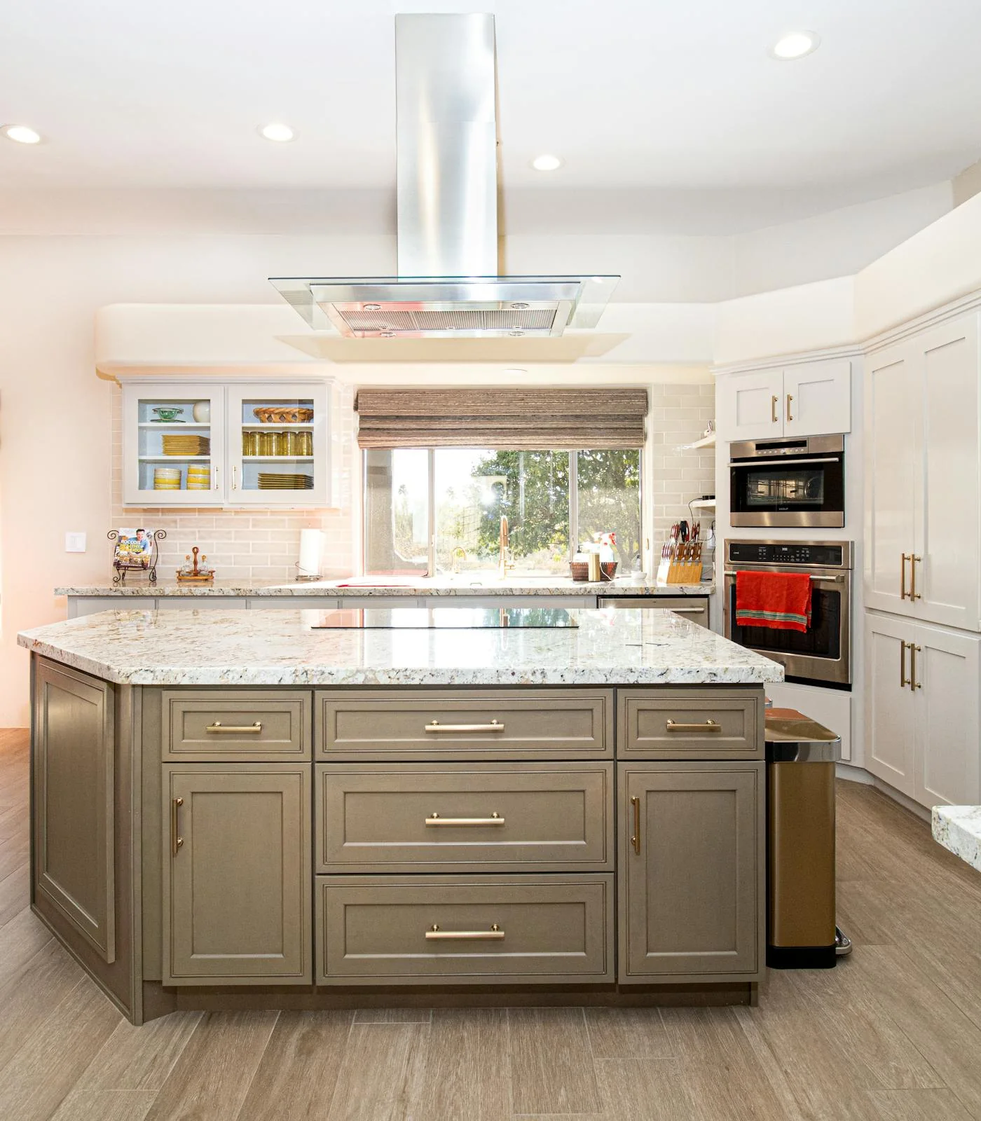 Light-filled designer kitchen with stone island