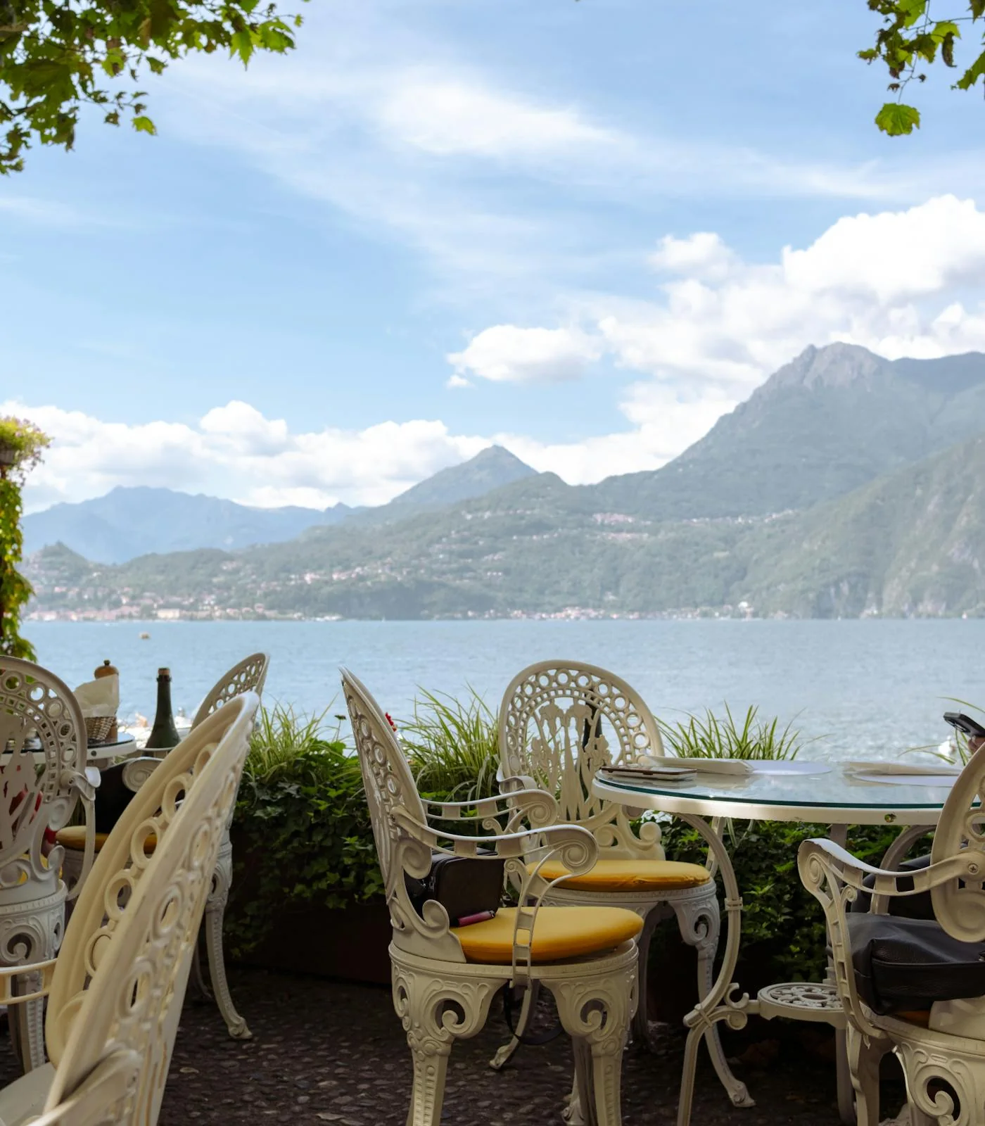 Outdoor dining terrace beside a mountain lake